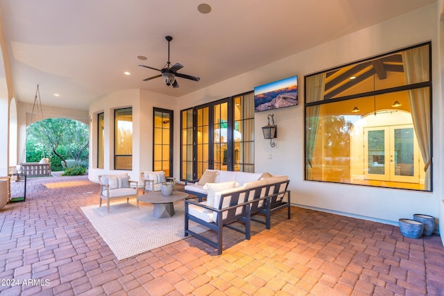 view of patio / terrace with french doors, an outdoor living space, and ceiling fan