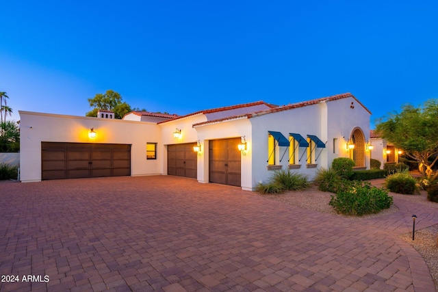 mediterranean / spanish-style home featuring a garage