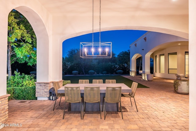 view of patio terrace at dusk