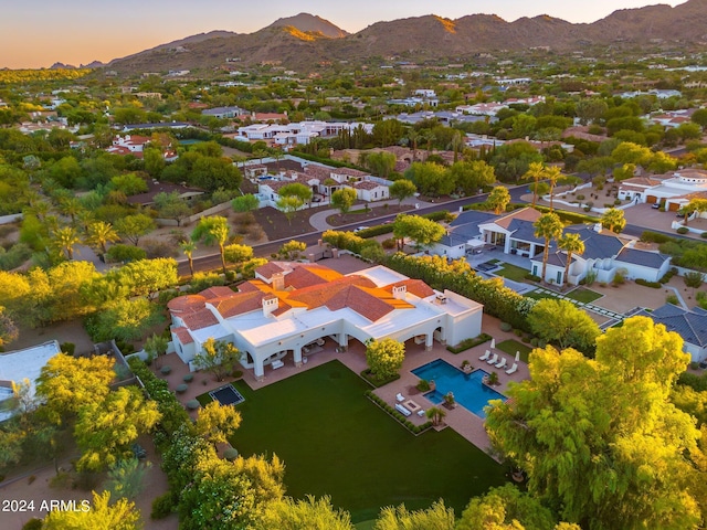 aerial view at dusk with a mountain view