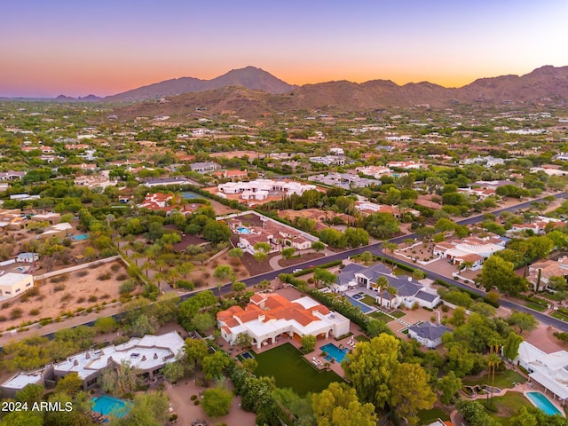 aerial view at dusk with a mountain view