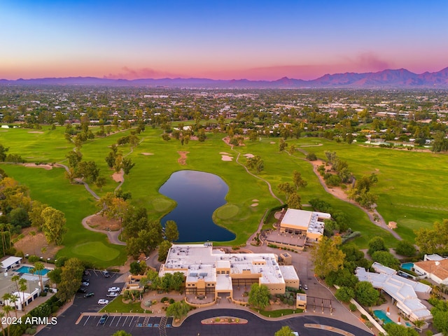 aerial view at dusk with a water and mountain view