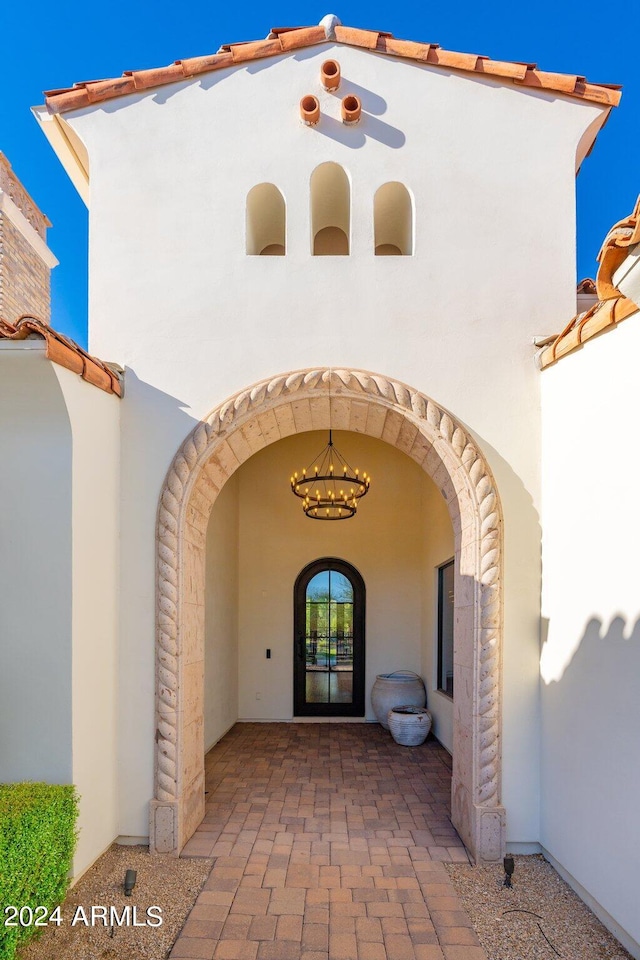 entrance to property with a patio