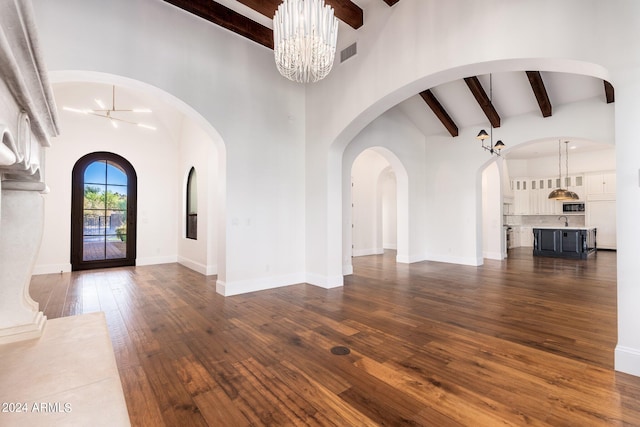 foyer with beamed ceiling, high vaulted ceiling, and dark hardwood / wood-style flooring