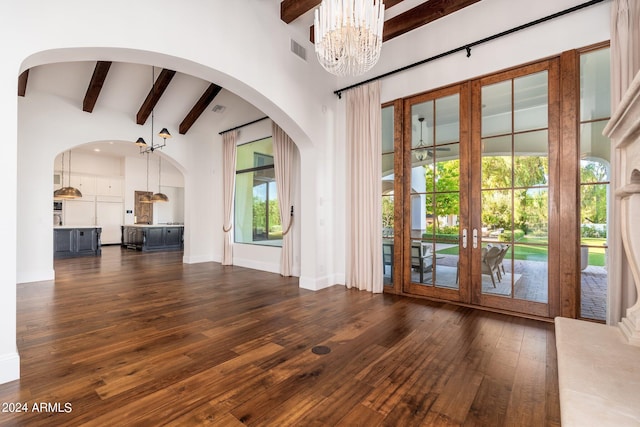 interior space featuring french doors, beamed ceiling, an inviting chandelier, high vaulted ceiling, and dark hardwood / wood-style flooring