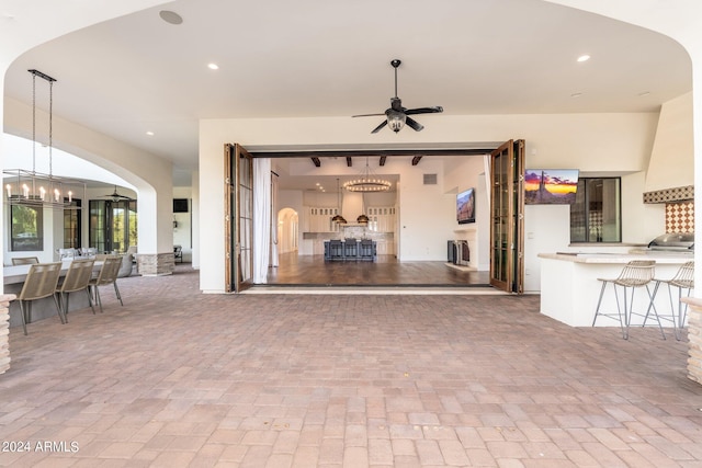 view of patio / terrace featuring an outdoor bar and ceiling fan