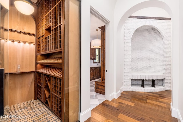 wine area featuring wood-type flooring