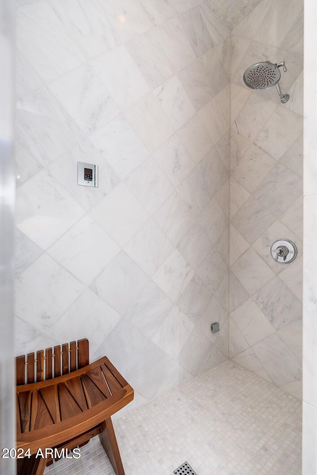 bathroom featuring tiled shower