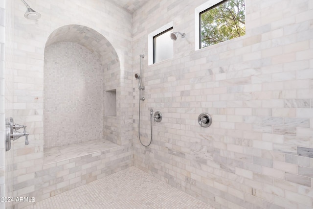 bathroom featuring tiled shower