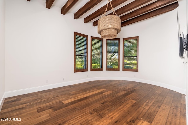 unfurnished room with beamed ceiling and dark hardwood / wood-style flooring