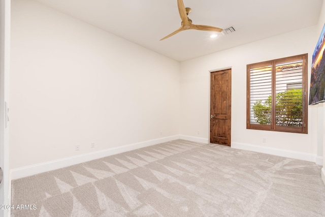 empty room featuring light colored carpet