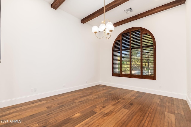 unfurnished room featuring an inviting chandelier, hardwood / wood-style floors, and lofted ceiling with beams