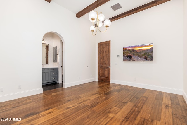 empty room featuring beam ceiling, high vaulted ceiling, and dark hardwood / wood-style flooring