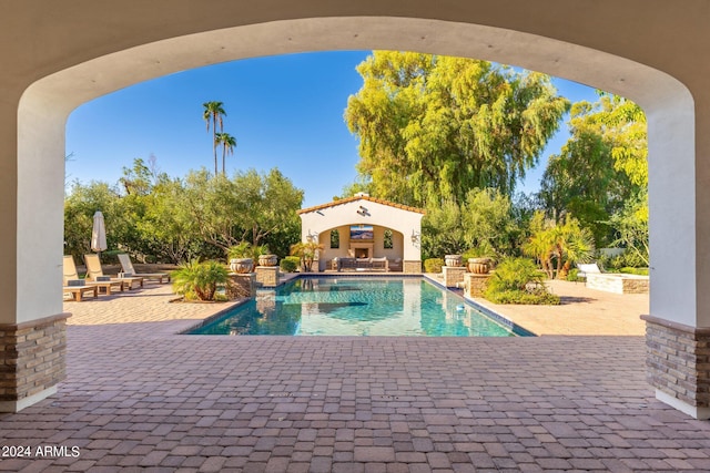 view of swimming pool featuring a patio