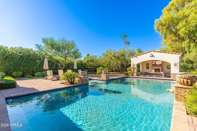 view of pool featuring a patio