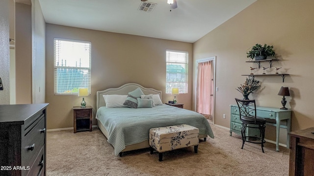 bedroom with light carpet, visible vents, lofted ceiling, and baseboards