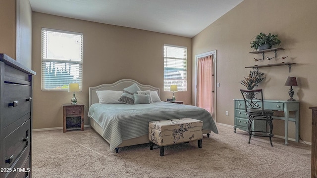 carpeted bedroom with multiple windows and baseboards