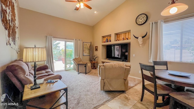 living room with high vaulted ceiling and ceiling fan