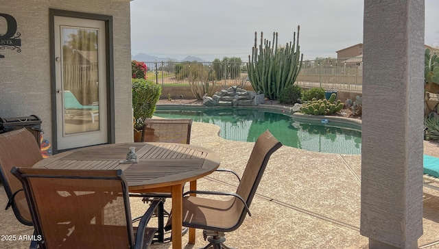 view of pool with a fenced in pool, a patio area, and fence