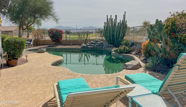 view of pool featuring a patio area, fence, and a fenced in pool