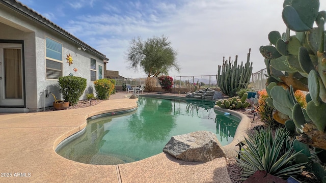 view of swimming pool with a patio area, a fenced in pool, and a fenced backyard