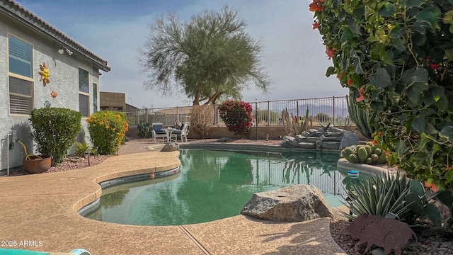 view of pool with a fenced in pool, a patio, and a fenced backyard