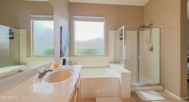 full bath featuring a stall shower, vanity, and a garden tub