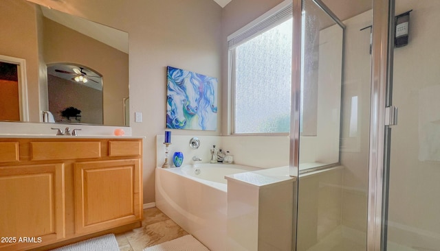 full bathroom featuring a ceiling fan, vanity, a bath, and a shower stall