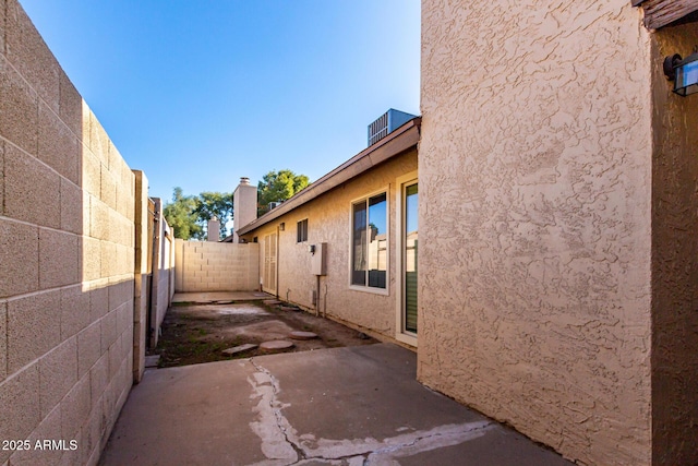 view of side of property featuring a patio area