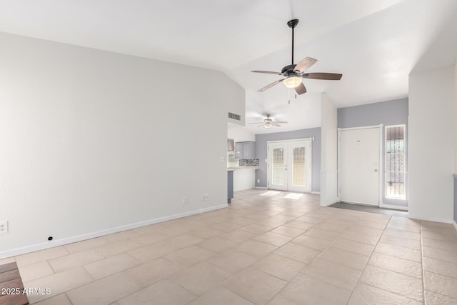 unfurnished living room featuring french doors, vaulted ceiling, ceiling fan, and light tile patterned flooring