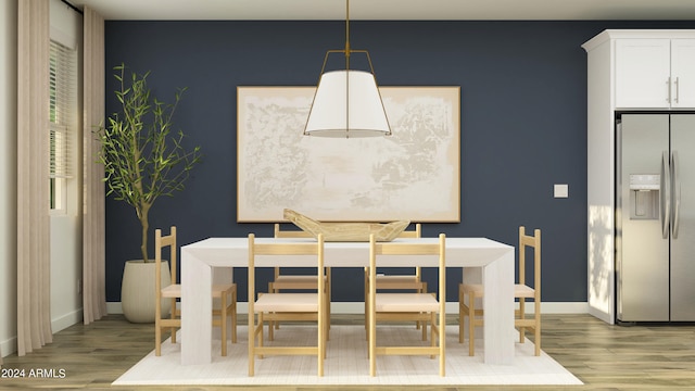 dining area with light wood-type flooring