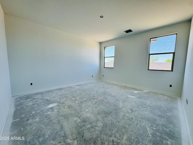 empty room featuring baseboards