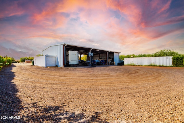 outdoor structure at dusk with a garage