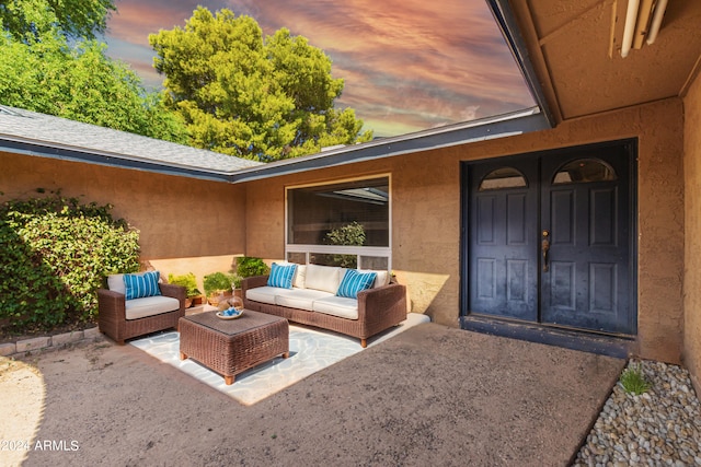 view of patio terrace at dusk