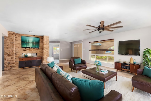 tiled living room featuring ceiling fan