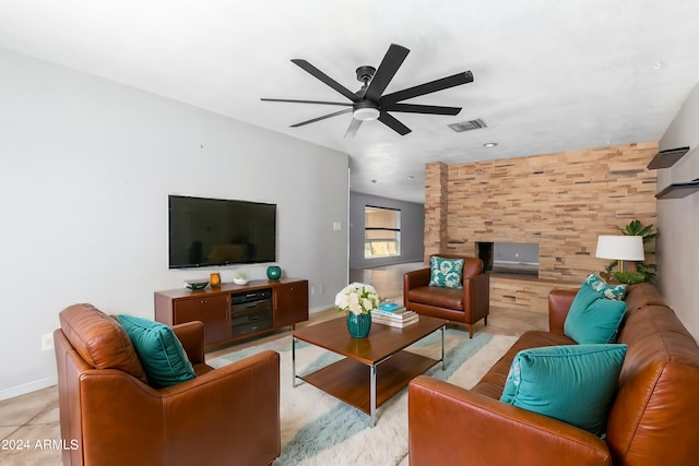 living room featuring ceiling fan and light tile patterned floors