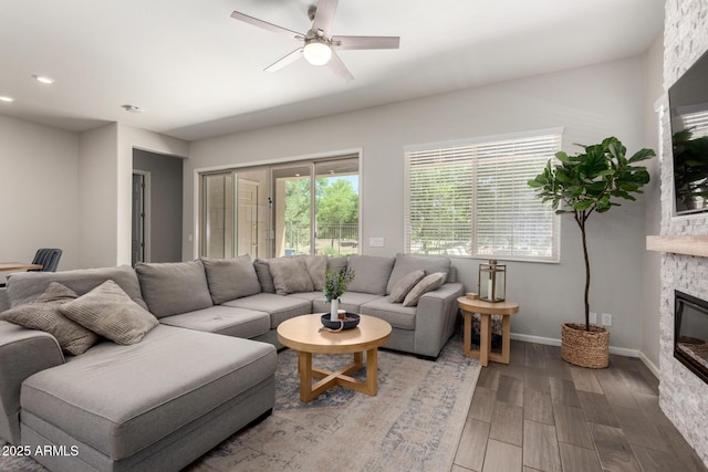 3081 E Desert Broom Pl, Chandler, AZ 85286 - living room featuring a fireplace, ceiling fan, wood finished floors, recessed lighting, and baseboards