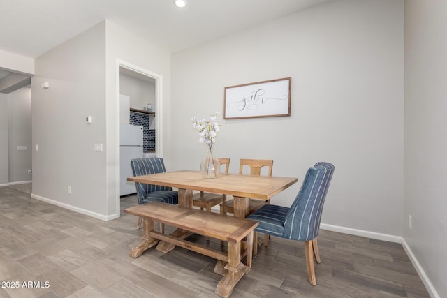 3081 E Desert Broom Pl, Chandler, AZ 85286 - dining room featuring baseboards, light wood-style floors, and recessed lighting