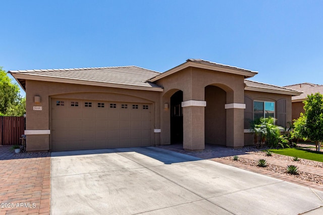 3081 E Desert Broom Pl, Chandler, AZ 85286 - view of front of home with driveway, stucco siding, an attached garage, and a tiled roof