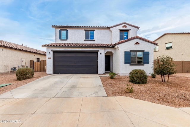 mediterranean / spanish-style home featuring a garage