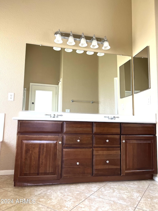 bathroom featuring tile patterned floors and vanity