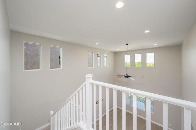 interior space with ceiling fan and wood-type flooring