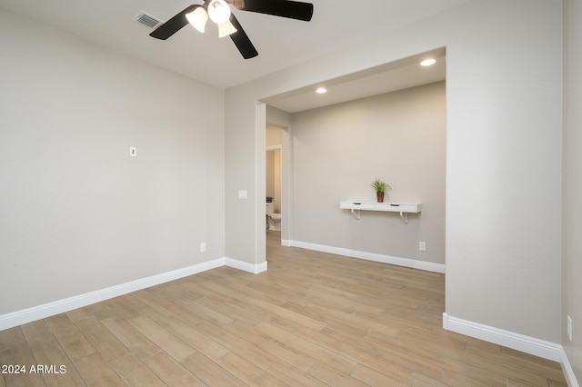 unfurnished room with ceiling fan and light wood-type flooring