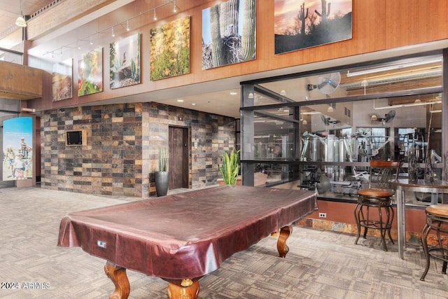 recreation room featuring pool table, a high ceiling, and carpet flooring