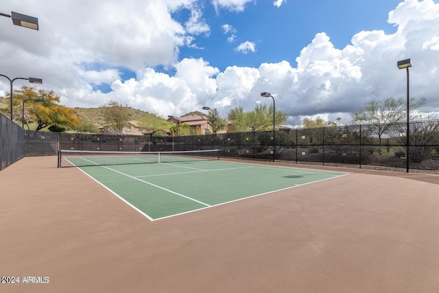 view of sport court with community basketball court and fence