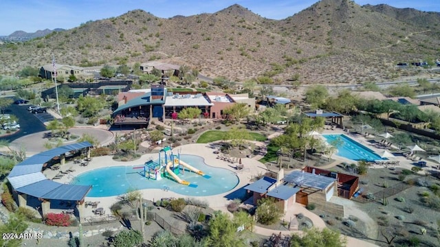 birds eye view of property featuring a mountain view