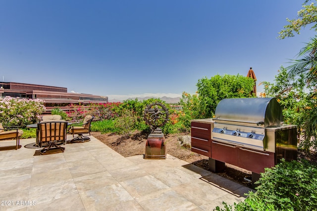 view of patio with exterior kitchen and grilling area