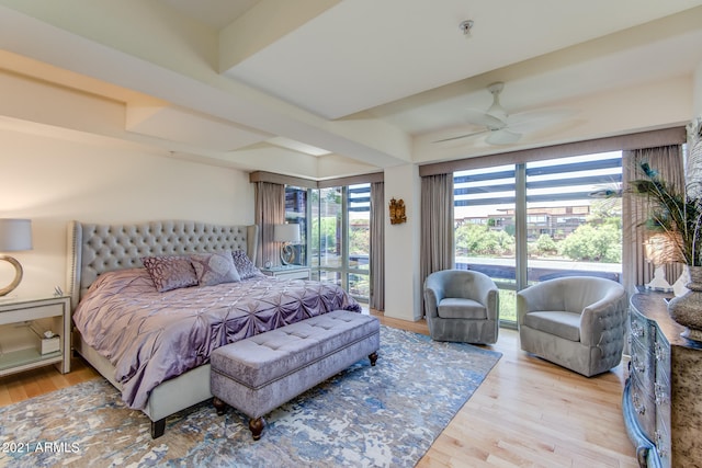 bedroom with light wood-type flooring, multiple windows, access to exterior, and ceiling fan