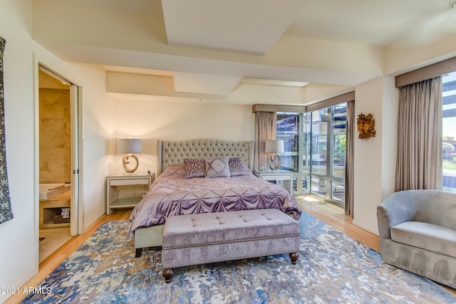 7161 E Rancho Vista Dr Unit 6001, Scottsdale, AZ 85251 - bedroom with ensuite bathroom, access to outside, and wood finished floors