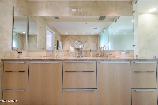 7161 E Rancho Vista Dr Unit 6001, Scottsdale, AZ 85251 - bathroom featuring double vanity, visible vents, and a sink